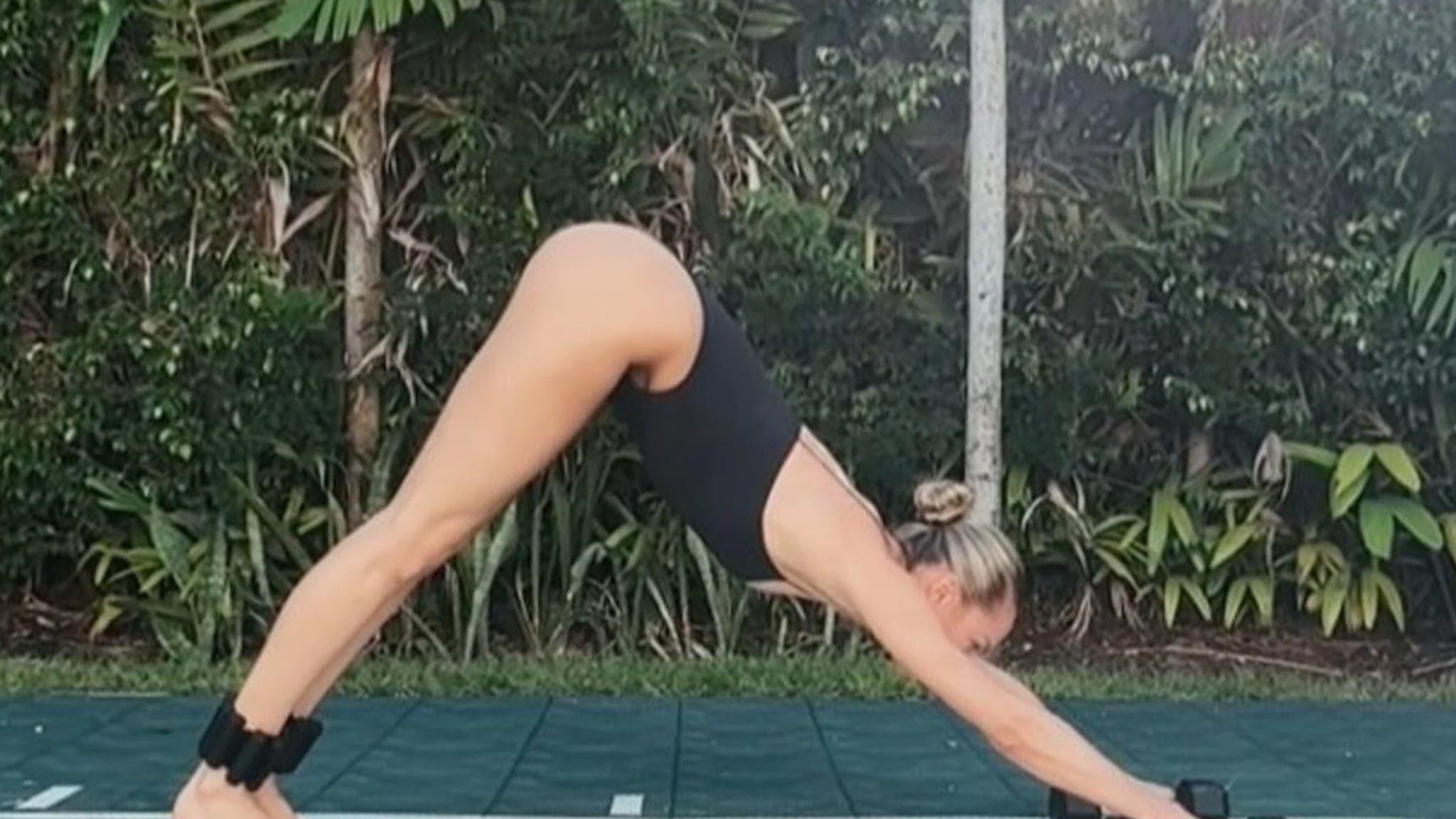 Flexibility and Fashion: Candice Swanepoel's Thong Leotard Yoga Session Breaks the Internet!